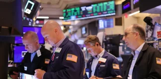 Nasdaq closes Friday at record high as Nvidia and the AI trade rallies on