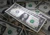 Dollar edges up ahead of Fed speak, Aussie dips