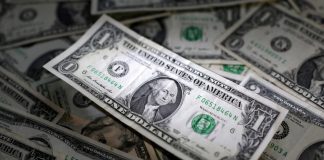 Dollar edges up ahead of Fed speak, Aussie dips