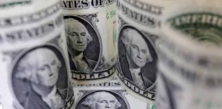 Shares cautious, dollar slips as trade concerns persist