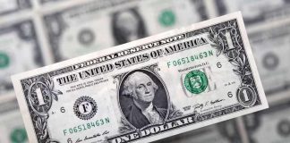 Dollar holds steady as Middle East keeps investors jittery