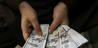 Dollar eyes first monthly gain for the year as Fed in no hurry to ease rates