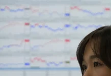 Asian shares are mixed after Wall Street’s strong start to the year cools