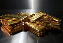 Gold falls 2% as dollar rises ahead of crucial inflation report